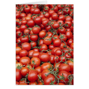 A large crop of tomato on a market stall in