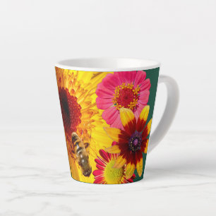 A latte cup of colorful flower and bee fun.