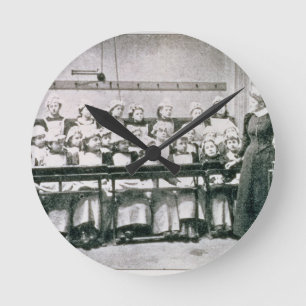 A Lesson in Domestic Science (b&w photo) Round Clock