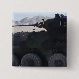 A light armoured vehicle fires 15 cm square badge