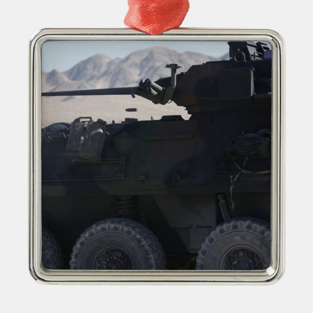 A light armoured vehicle fires metal tree decoration (Front)