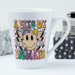 A Little Bit Dramatic Funny Groovy Saying Latte Mug<br><div class="desc">A Little Bit Dramatic Funny Groovy Saying Typography Tea Coffee Latte Mug features the text "A Little Bit Dramatic" in modern typography on a pink chequerboard background with groovy flowers,  lightening bolts and a smiling face. Designed by Evco Studio www.zazzle.com/store/evcostudio</div>