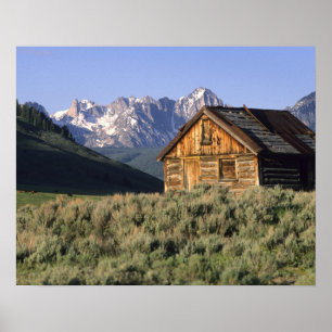 A log cabin and the Sawtooth Mountains in Poster
