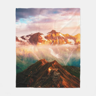 A look at the sunlit hills at twilight. Dramatic e Fleece Blanket