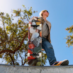 a lot of beautifully coloured stones skateboard