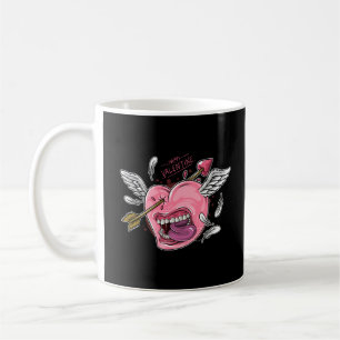 a love heart with lips and wings that are hit by l coffee mug
