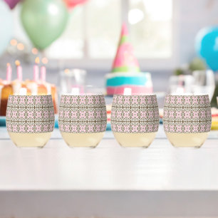 A lovely pink and brown patterned background featu stemless wine glass