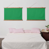 A lush green backdrop with a clean white square po