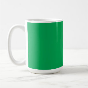 A lush green fern with delicate, intricately patte coffee mug