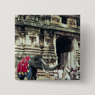 A man being blessed by an elephant 15 cm square badge