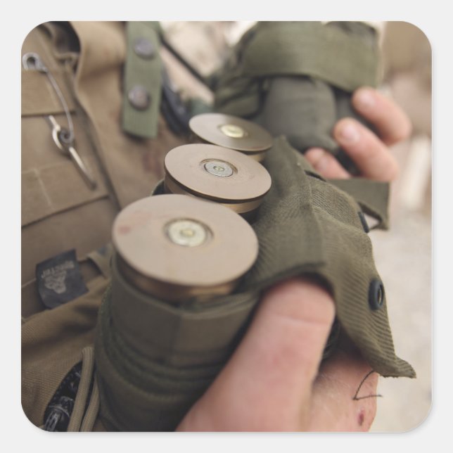 A Marine cradles handfuls of 40 mm grenades Square Sticker (Front)