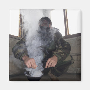 A marine fills the gas chamber with more CS gas Magnet