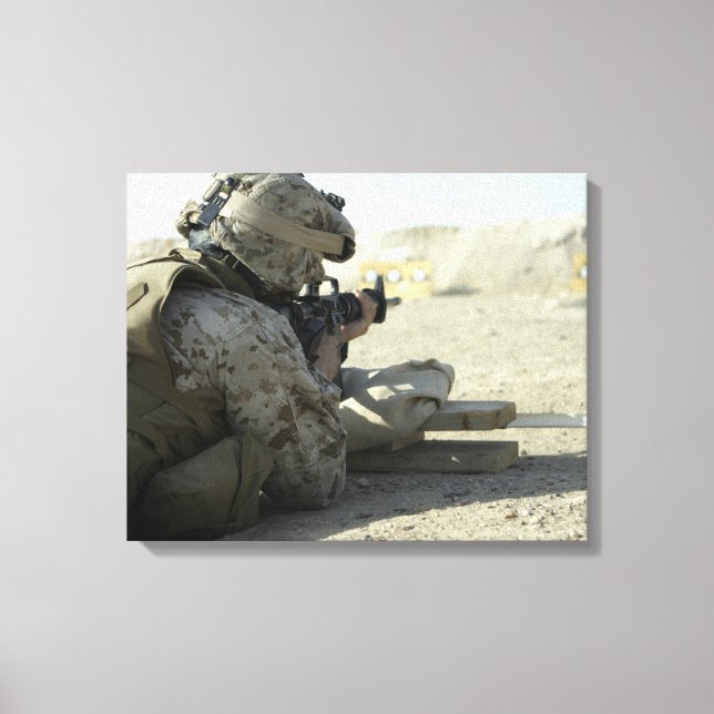 A Marine fires a M16A2 service rifle Canvas Print (Front)