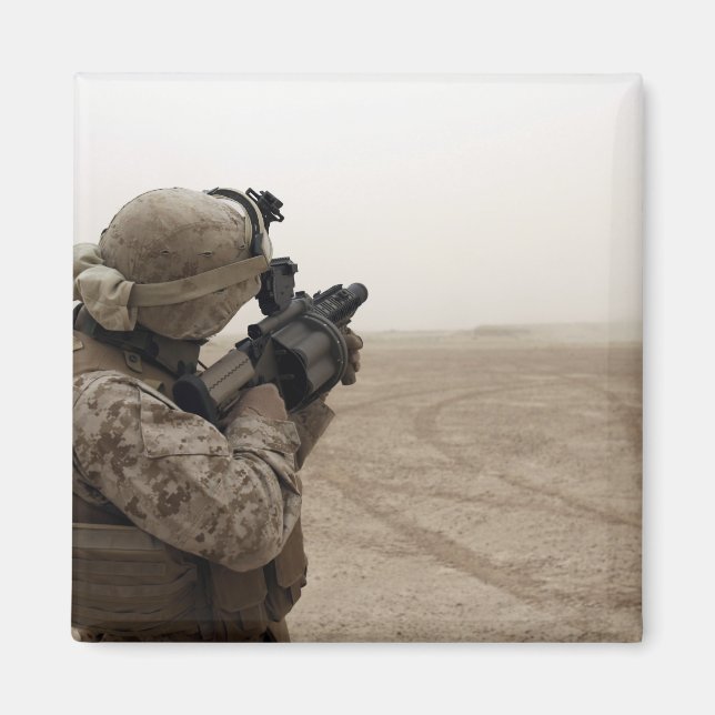 A Marine fires the M-32 Magnet (Front)