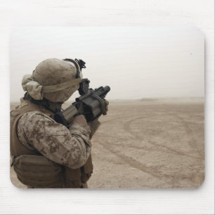 A Marine fires the M-32 Mouse Mat