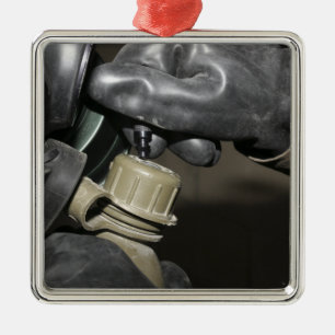 A Marine inserts a drinking tube into his cante Metal Tree Decoration