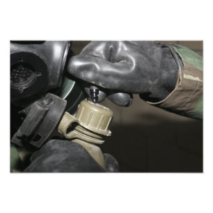 A Marine inserts a drinking tube into his cante Photo Print