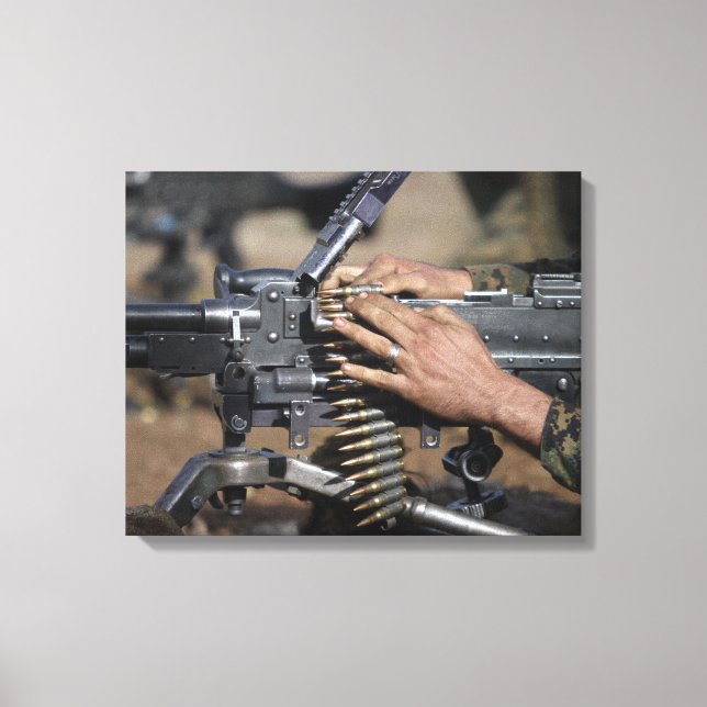 A Marine loads a M-240G machine gun Canvas Print (Front)