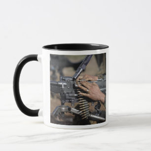 A Marine loads a M-240G machine gun Mug
