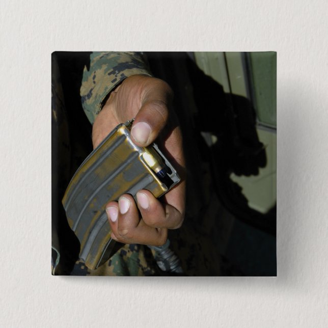 A Marine loads blank ammunition rounds 15 Cm Square Badge (Front)