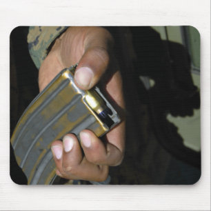 A Marine loads blank ammunition rounds Mouse Mat