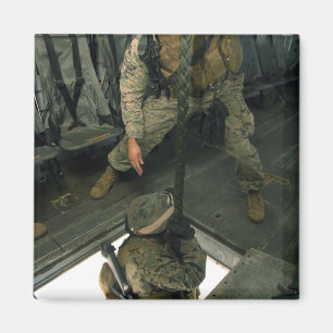 A Marine sends a fellow Marine down the hell ho Magnet