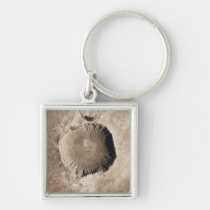 A meteorite impact crater key ring