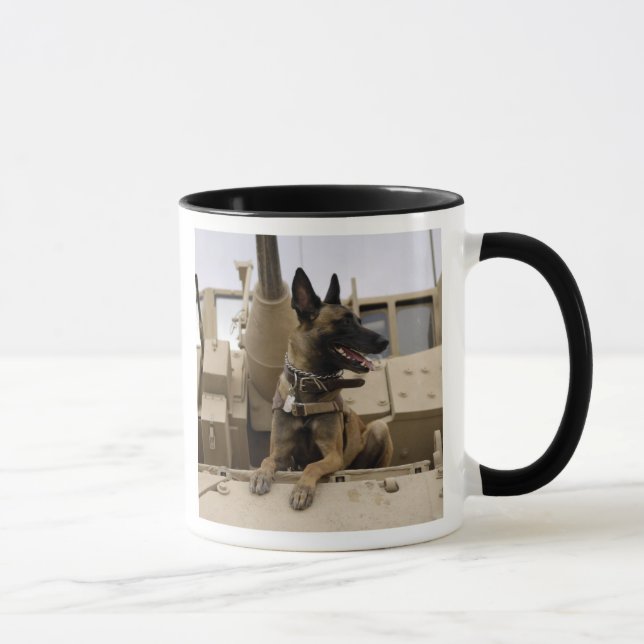 A military working dog sits on a M2A3 Mug (Right)