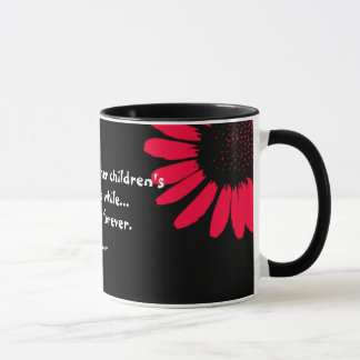 "A mother holds her..." Mug