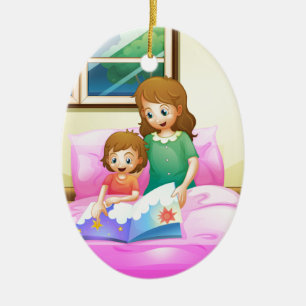 A mother reading with her daughter ceramic tree decoration