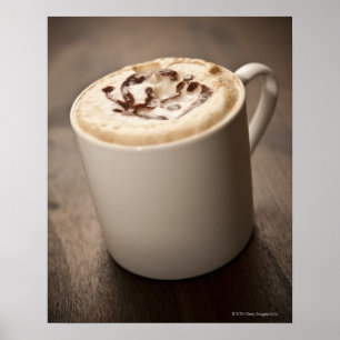 A mug of Cappuccino coffee topped with melted Poster