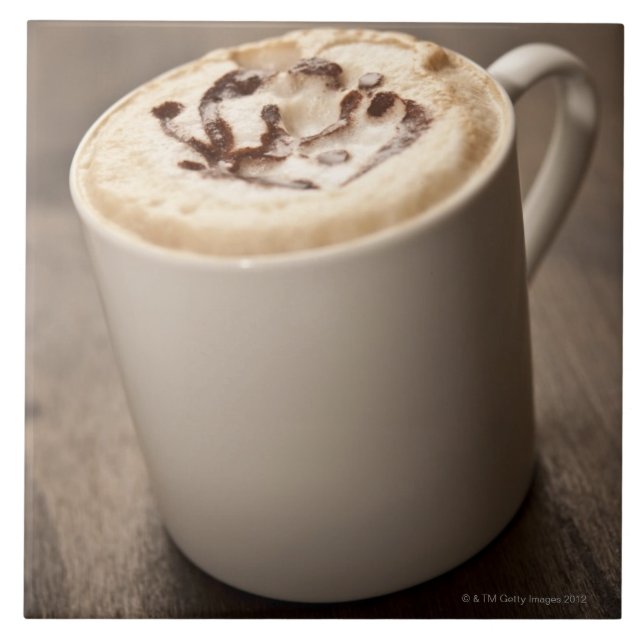 A mug of Cappuccino coffee topped with melted Tile (Front)