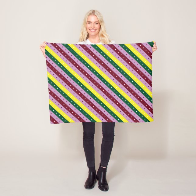 a multicolored striped pattern with dots fleece blanket (In Situ)
