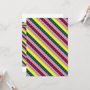 a multicolored striped pattern with dots invitation
