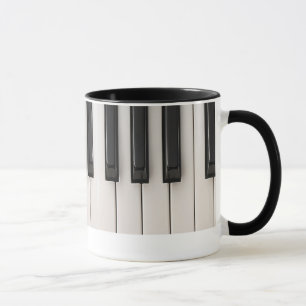 A musical illustration of a piano keyboard. mug