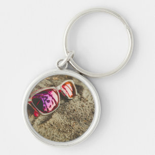 A Pair Of Fashionable Sunglasses On The Beach Key Ring