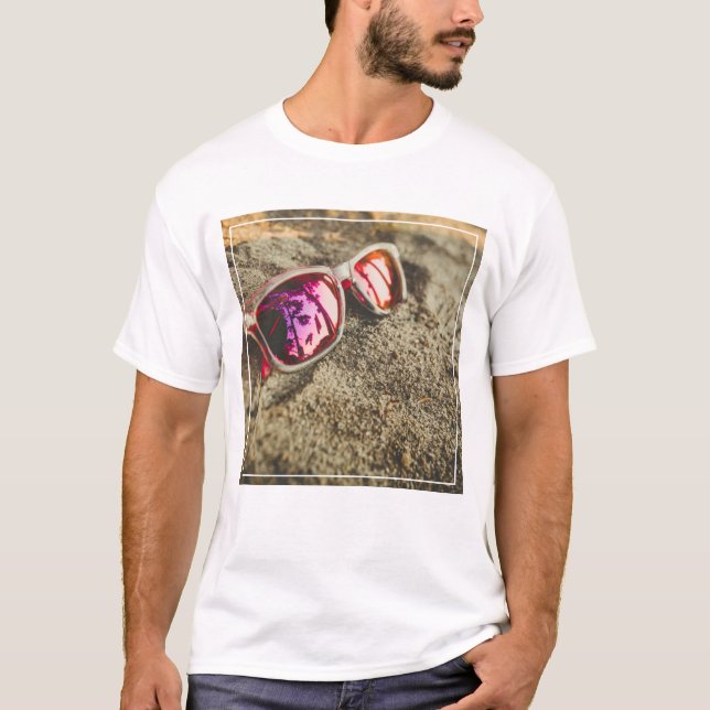 A Pair Of Fashionable Sunglasses On The Beach T-Shirt (Front)