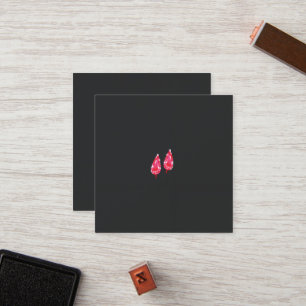 a pair of red leaves on a black background loyalty card