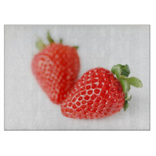 A Pair of Red Strawberries Cutting Board