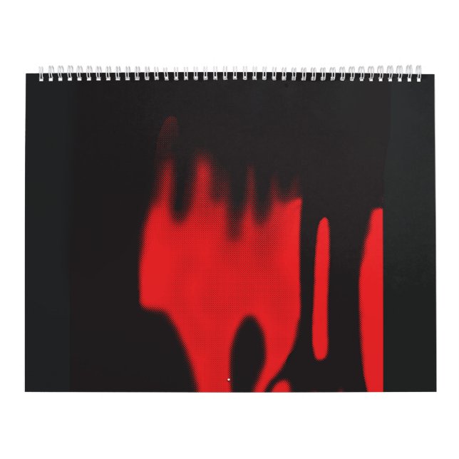 a pair of shoes sitting on top of a floor calendar (Cover)