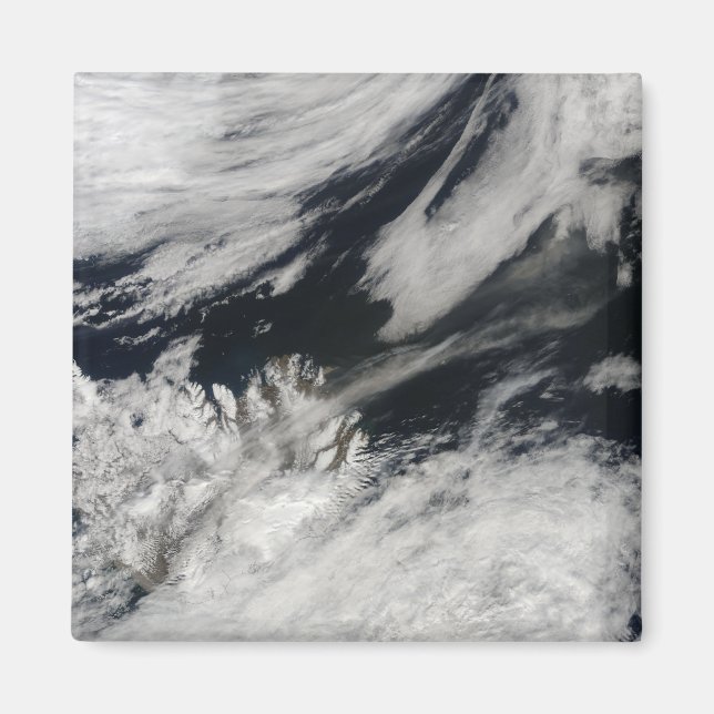 A pale grey ash plume blows from the summit magnet (Front)