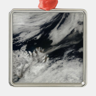 A pale grey ash plume blows from the summit metal tree decoration