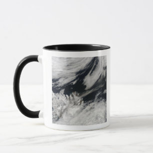 A pale grey ash plume blows from the summit mug
