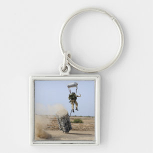 A pararescueman drops into the zone key ring
