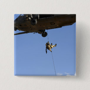 A pararescueman rappels from an HH-60 15 Cm Square Badge