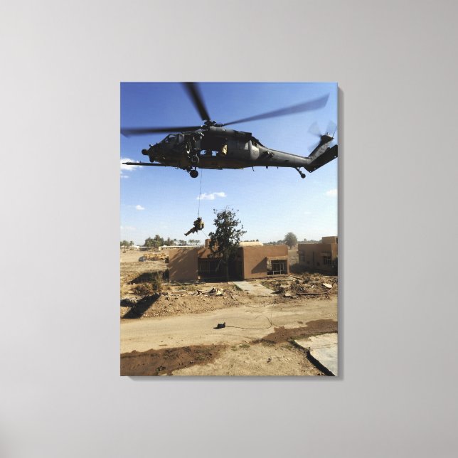 A pararescueman rappels from an HH-60 2 Canvas Print (Front)