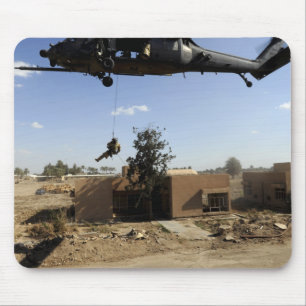 A pararescueman rappels from an HH-60 2 Mouse Mat
