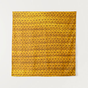 A pattern of yellow knitted fabric of yarn. tapestry