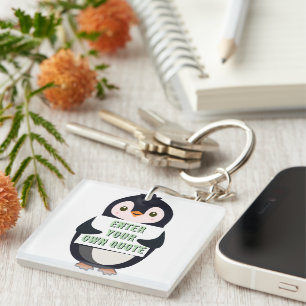 A penguin holding a sign with customizable text th key ring