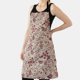 A person wears a floral-patterned apron 